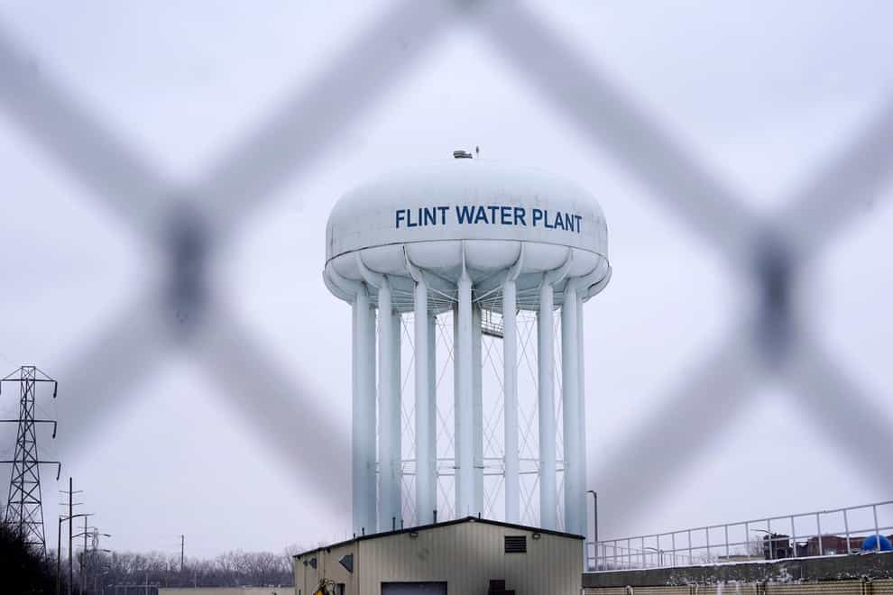 The Flint water plant tower in Flint, Michigan. A judge dismissed criminal charges against former Michigan governor Rick Snyder (Carlos Osorio/AP/PA)