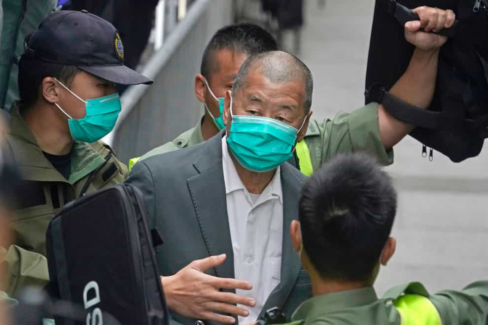 A Hong Kong court sentenced a pro-democracy media tycoon to five years and nine months in prison on Saturday over two fraud charges linked to lease violations (Kin Cheung/AP)