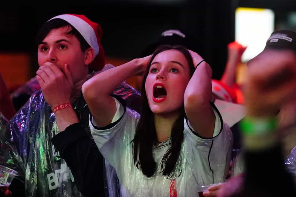 England fans react following France’s second goal (PA)