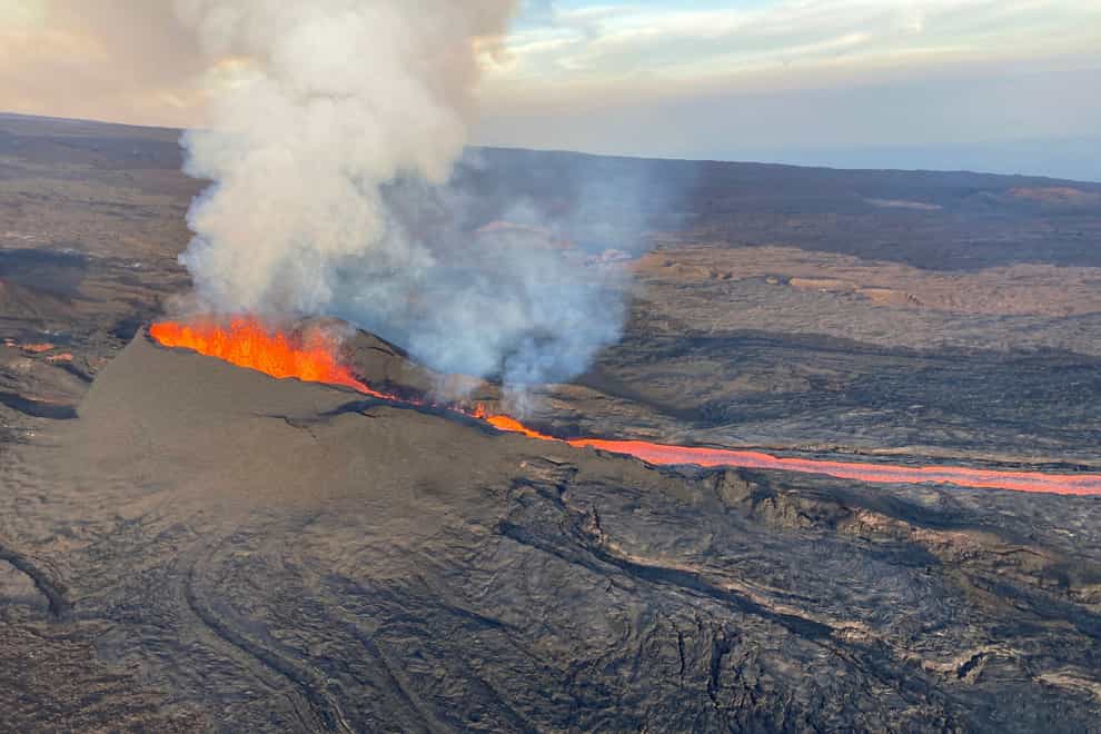 Mauna Loa in Hawaii, the world’s largest volcano, continues to erupt but scientists say lava is no longer feeding the flow front that has been creeping towards a crucial highway (US Geological Survey/AP)