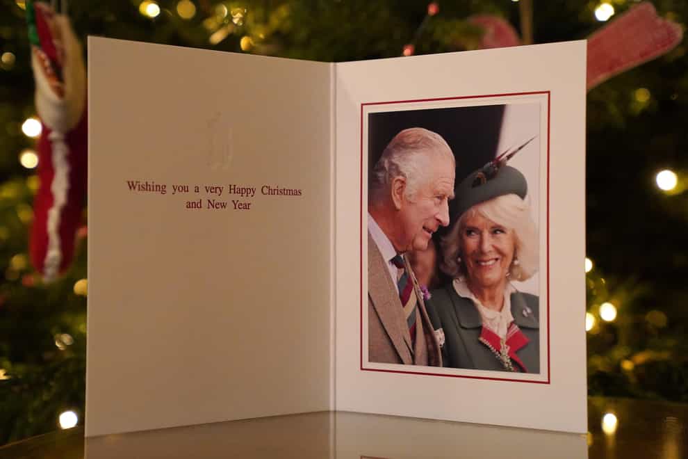 The King and Queen Consort have chosen a photograph taken at a Highland Gathering for their Christmas card this year (Jonathan Brady/PA)