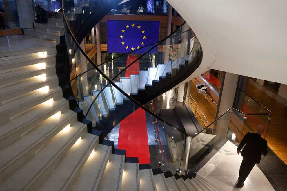 A man walks down stairs during a special session on lobbying at the European Parliament in Strasbourg, eastern France (Jean-Francois Badias/AP)