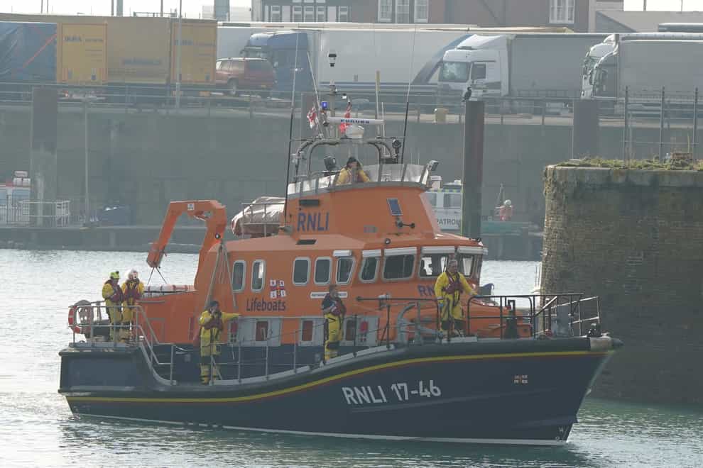 The Dover lifeboat returns to the Port of Dover after a large search and rescue operation launched in the Channel off the coast of Dungeness, in Kent, following an incident involving a small boat likely to have been carrying migrants. Three people have died following the incident and 43 people have been rescued, a Government source said (Gareth Fuller/PA)