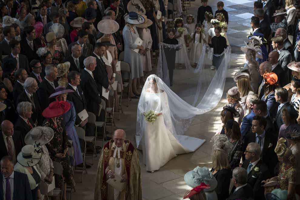 Duchess of Sussex walking down the aisle as she arrives in St George’s Chapel at Windsor Castle for her wedding to the duke (Danny Lawson/PA)