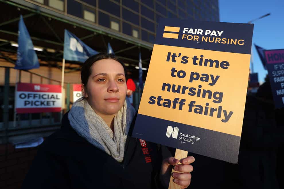 Staff Nurse Courtney Watson joins members of the Royal College of Nursing on the picket line outside Mater Infirmorum Hospital in Belfast (Liam McBurney/PA)