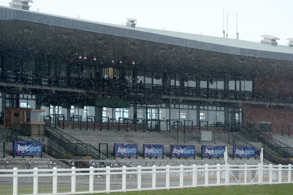 Snow falls in front of an empty grandstand during the 2021 Fairyhouse Easter Festival at the Fairyhouse racecourse, Ireland. Picture date: Monday April 5, 2021.