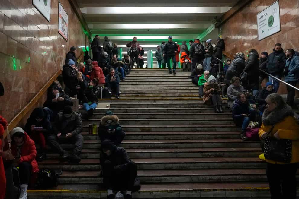 People shelter in a subway station in Kyiv (Efrem Lukatsky/AP)