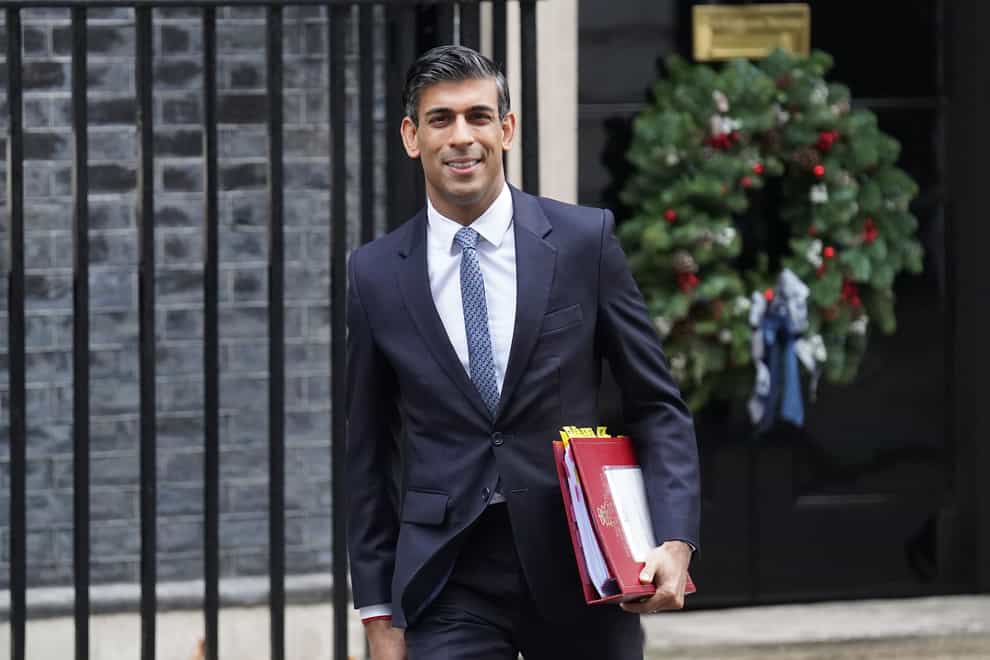 Prime Minister Rishi Sunak said he is working ‘fat out’ to restore powersharing in NI (James Manning/PA)