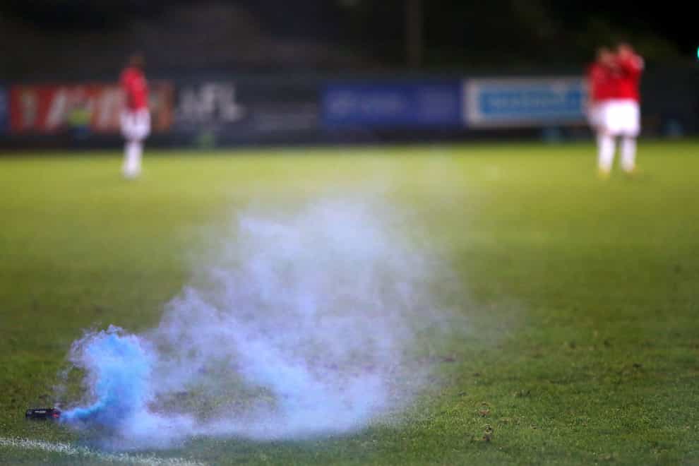 Tom Glover was struck over the head with a bucket after flares were thrown onto the field (Barrington Coombs/PA)