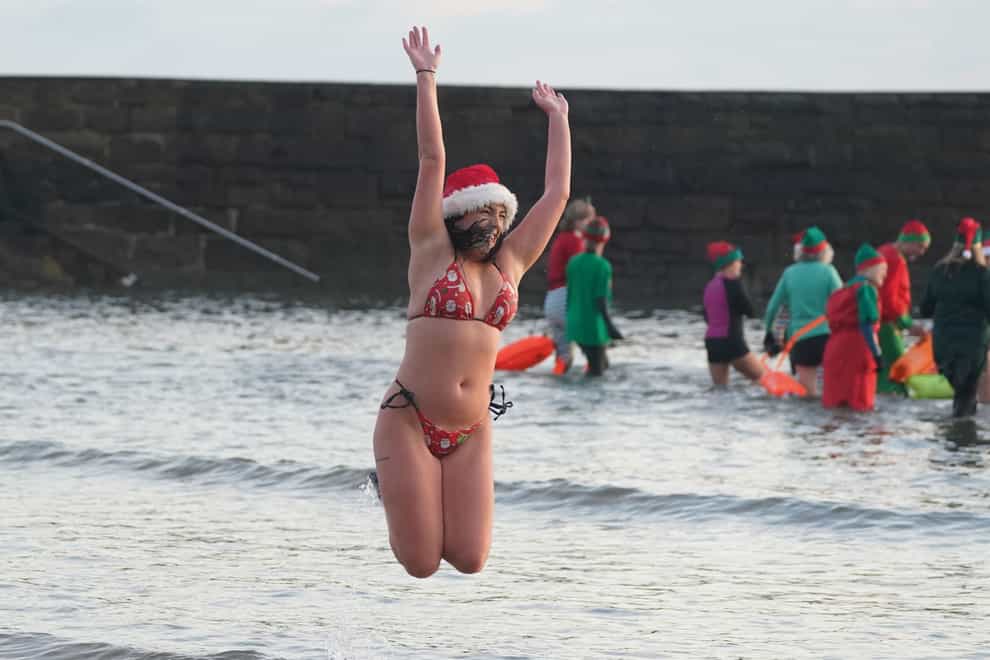Cold water swimmers at Cullercoats Bay on the North East coast (Owen Humphreys/PA)