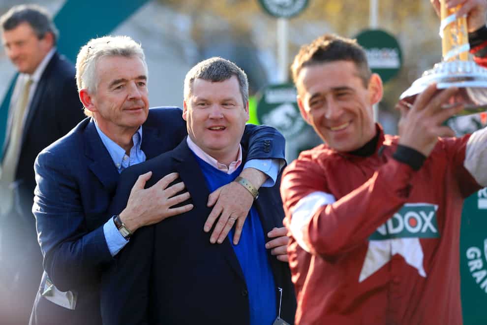 (left to right) Owner Michael O’Leary, Trainer Gordon Elliott and Jockey Davy Russell celebrate winning the Grand National Handicap Chase with Tiger Roll in 2019 at Aintree (Mike Egerton)