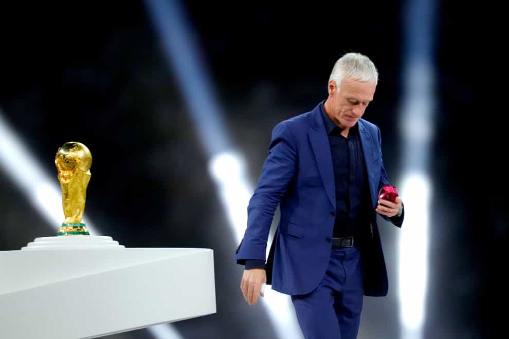France manager Didier Deschamps walks past the World Cup trophy (Nick Potts/PA)