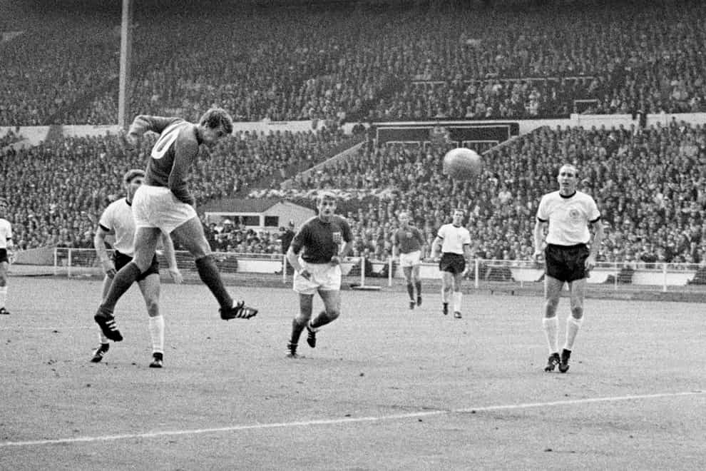 England’s Geoff Hurst (second left) heads the equaliser in the 1966 World Cup final (PA)