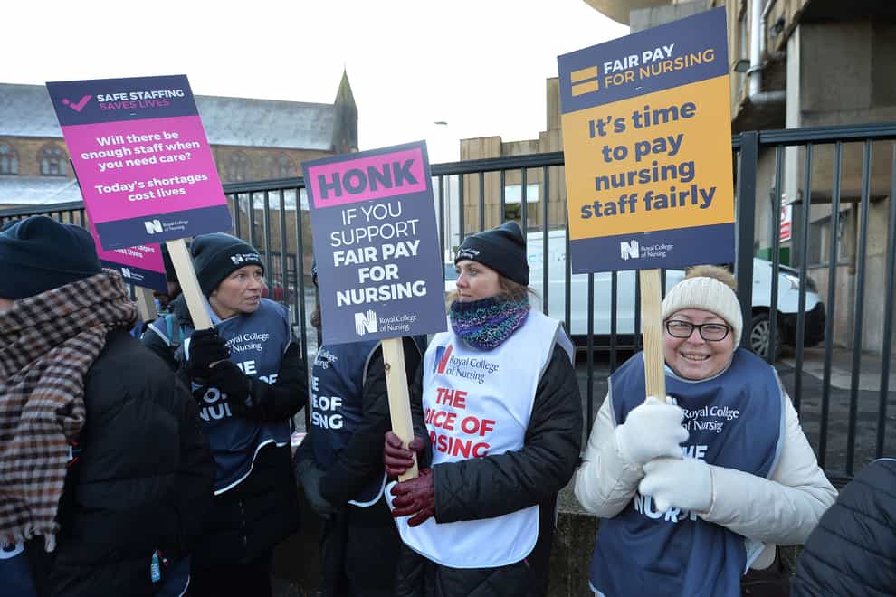 Members of the Royal College of Nursing (RCN) on the picket line outside the Royal Liverpool University Hospital in Liverpool on December 15. A second walkout is planned for Tuesday. Picture date: Thursday December 15, 2022.