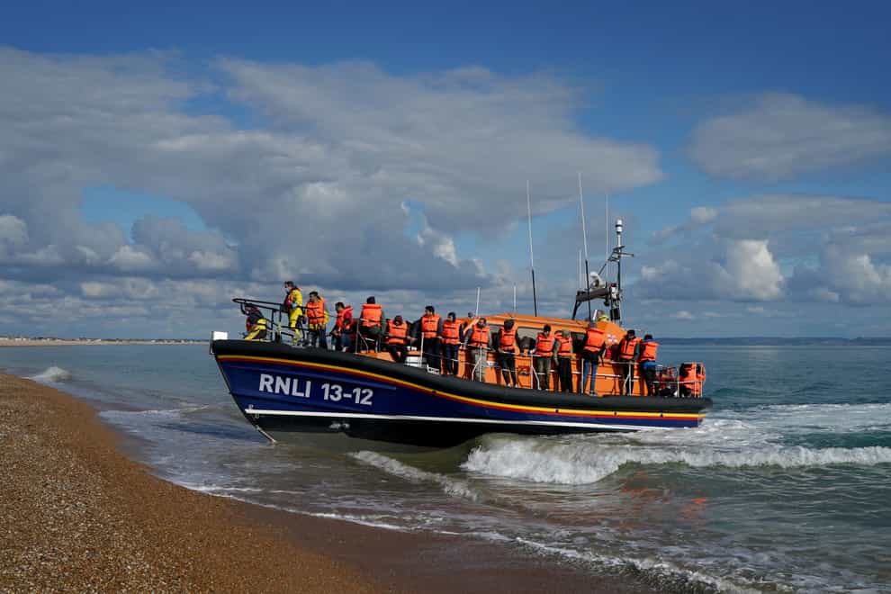 A group of people thought to be migrants are brought in to Dungeness, Kent (PA)