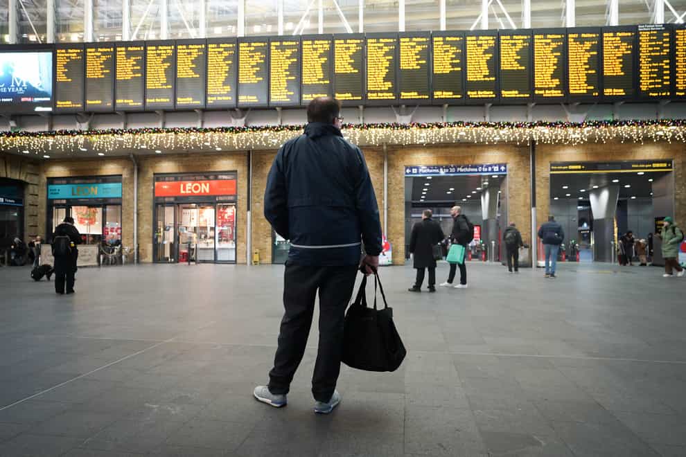Strikes by railway workers will cause severe disruption to services on Christmas Eve, Network Rail has warned (James Manning/PA)
