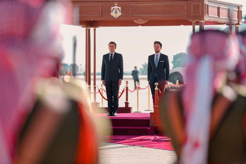 Jordan’s Crown Prince Hussein and French President Emmanuel Macron attend a welcome ceremony at the airport in Amman, Jordan (The Royal Hashemite Court via AP/PA)