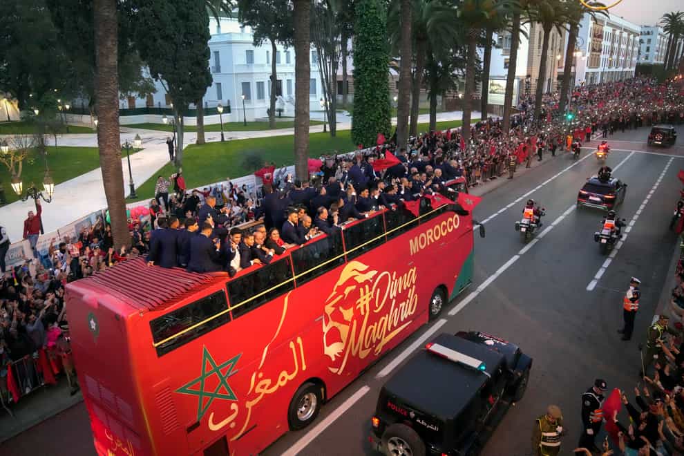 The players of Morocco national football team celebrate during a homecoming parade in central Rabat, Morocco (Mosa’ab Elshamy/AP/PA)