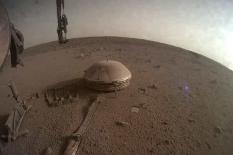 Nasa’s InSight lander on Mars. The lander’s power levels have been dwindling for months because of dust coating its solar panels (NASA via AP/PA)