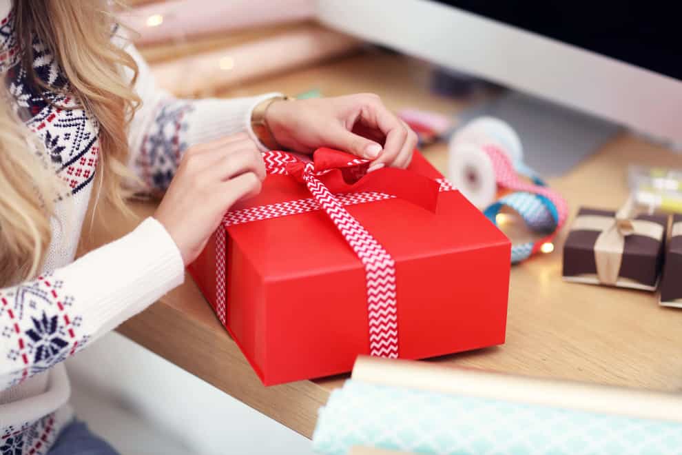 A survey found consumers are buying fewer and cheaper Christmas presents this year (Alamy/PA)