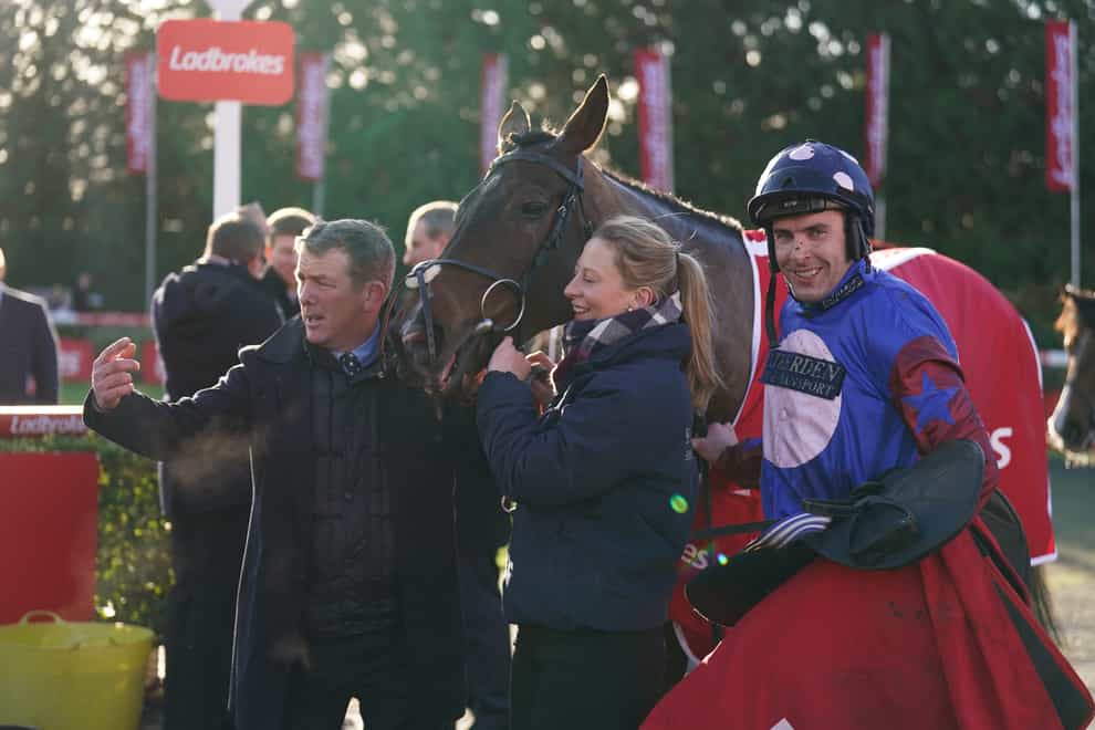 Aidan Coleman (right), assistant trainer Barry Fenton and head lass Becca James with Paisley Park (John Walton/PA)