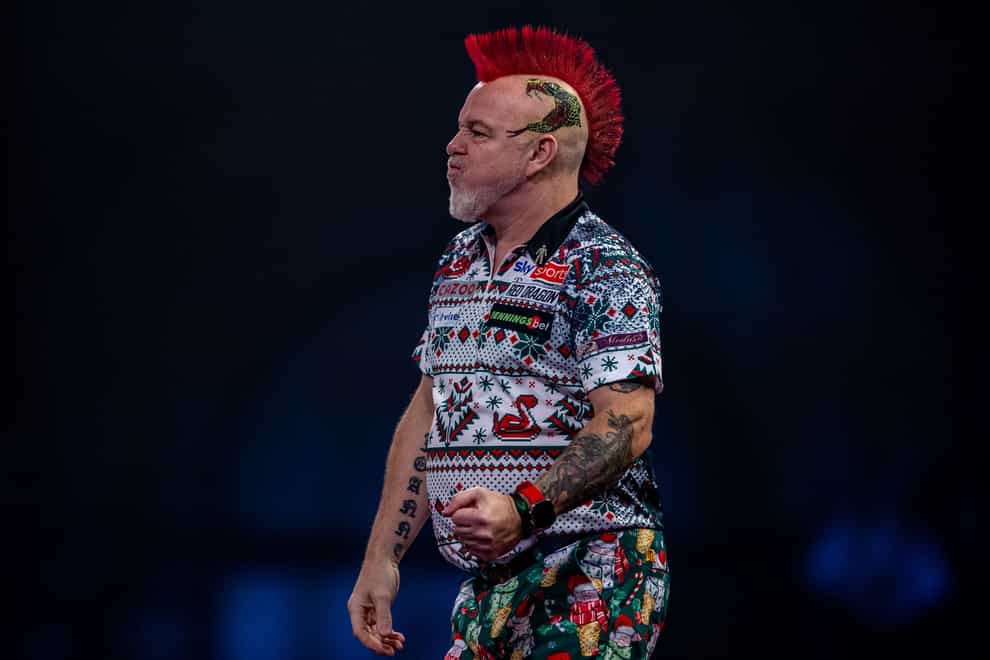 Peter Wright saw his hopes of retaining his PDC World Championship title end with defeat to Kim Huybrechts (Steven Paston/PA)