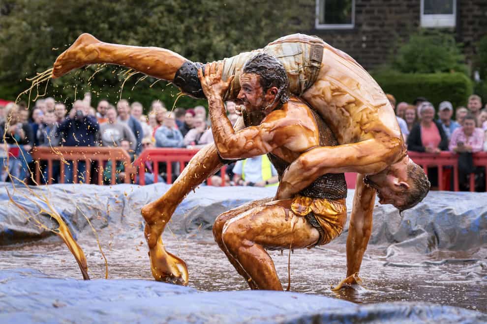 Competitors take part the World Gravy Wrestling Championships at the Rose ‘N’ Bowl, in Rossendale, Lancashire (Danny Lawson/PA)