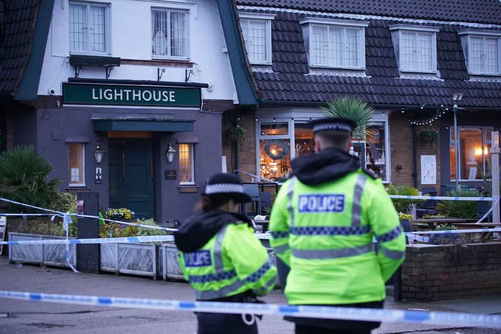 Police officers on duty at the Lighthouse Inn in Wallasey Village, Wirral (Peter Byrne/PA)