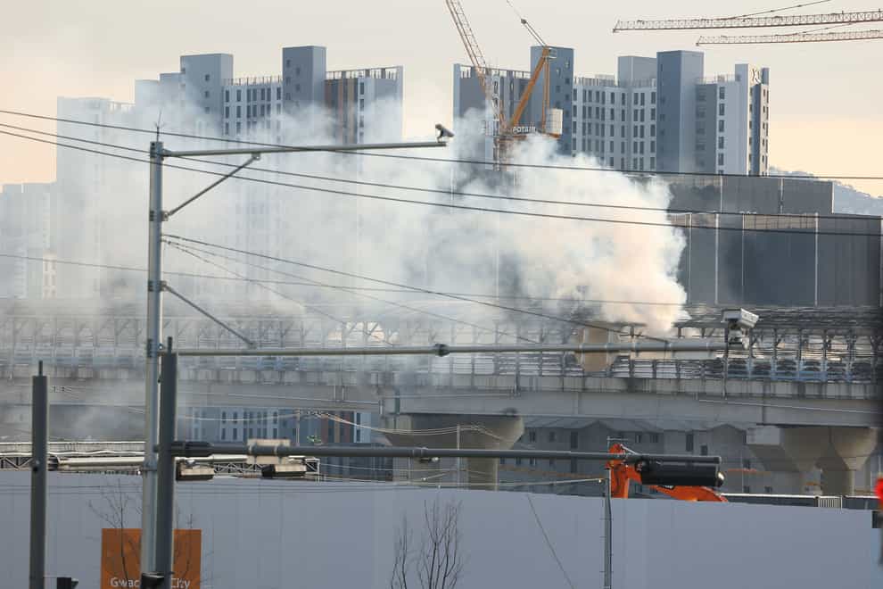 Smoke rises at the scene of the accident (Kim Do-hun/Yonhap/AP)