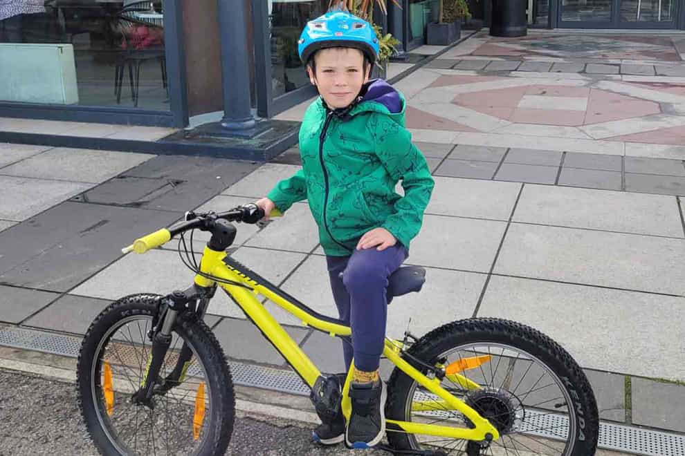 Elliott Evans took part in a sponsored bike ride to raise funds for the hospital which cared for him after he banged his head (Swansea Bay University Health Board/PA)