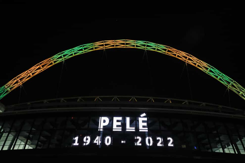 The Wembley arch is lit up in the colours of Brazil in memory of Pele (Kieran Cleeves/PA).