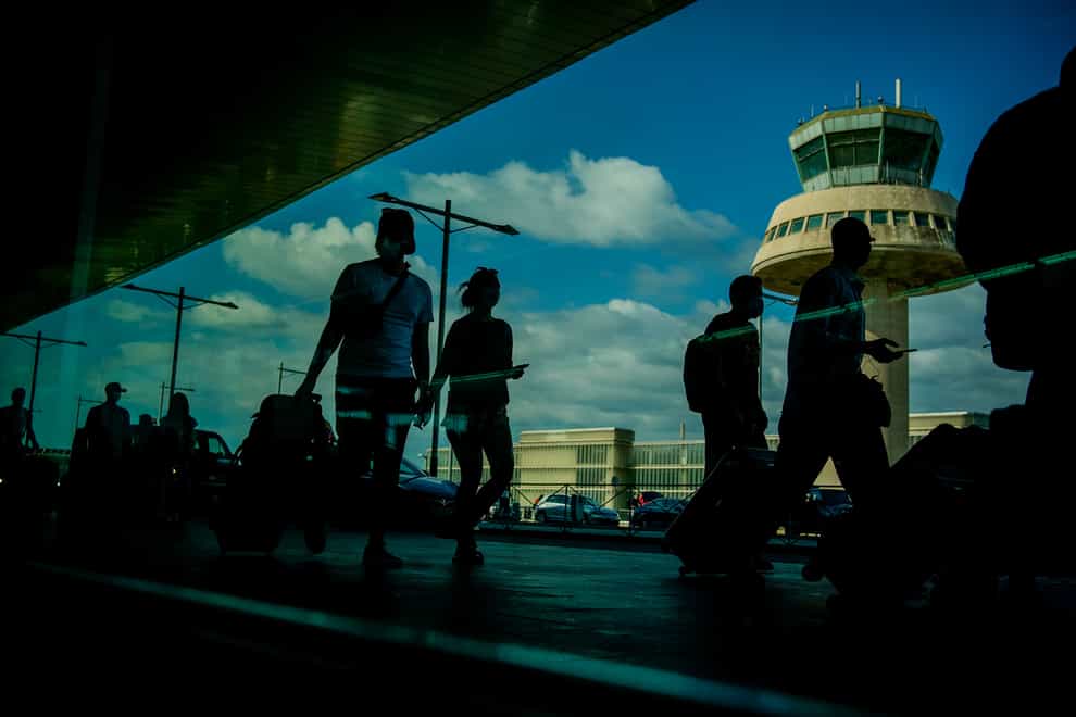 Passengers at Barcelona airport, Spain (Joan Mateu/AP/PA)