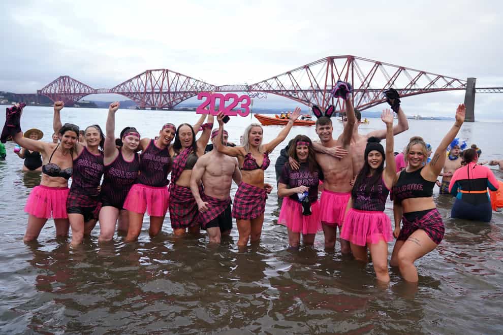 People take part in the Loony Dook New Year’s Day dip in the Firth of Forth at South Queensferry (Andrew Milligan/PA)