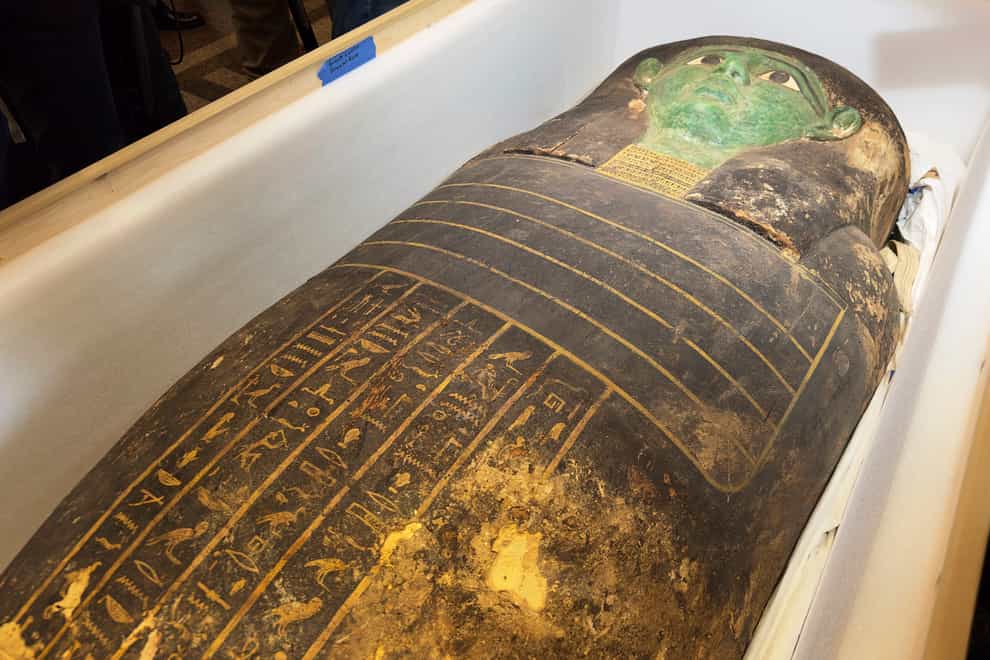 An ancient wooden sarcophagus is displayed during a handover ceremony at the foreign ministry in Cairo, Egypt, Monday, Jan. 2, 2023. An ancient wooden sarcophagus that was featured at the Houston Museum of Natural Sciences was returned to Egypt after U.S. authorities determined it was looted years ago, Egyptian officials said on Monday (Mohamed Salah/AP/PA)