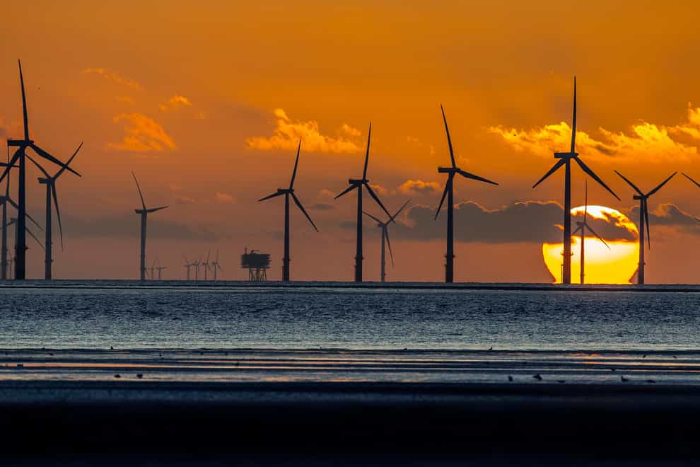 Burbo Bank wind farm in front of sunset (Peter Byrne/PA)