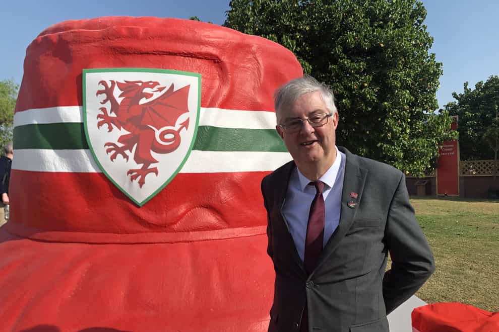 Wales First Minister Mark Drakeford in front of the giant bucket hat on the Corniche in Doha, Qatar during the FIFA World Cup 2022 (Bronwen Weatherby/PA)