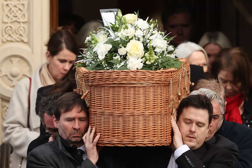 The coffin of former Press Association journalist Brian Hutton who died suddenly on Saturday , leaves St Patrick’s Roman Catholic Church in Derry after his funeral (Liam McBurney/PA)