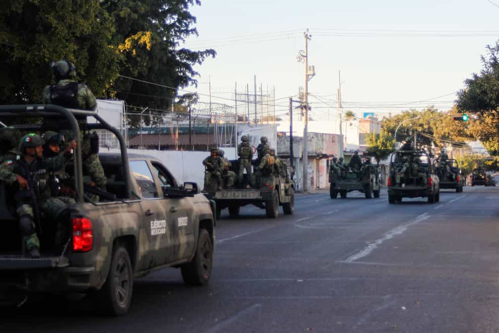 An army convoy patrols the streets of Culiacan (Martin Urista/AP)