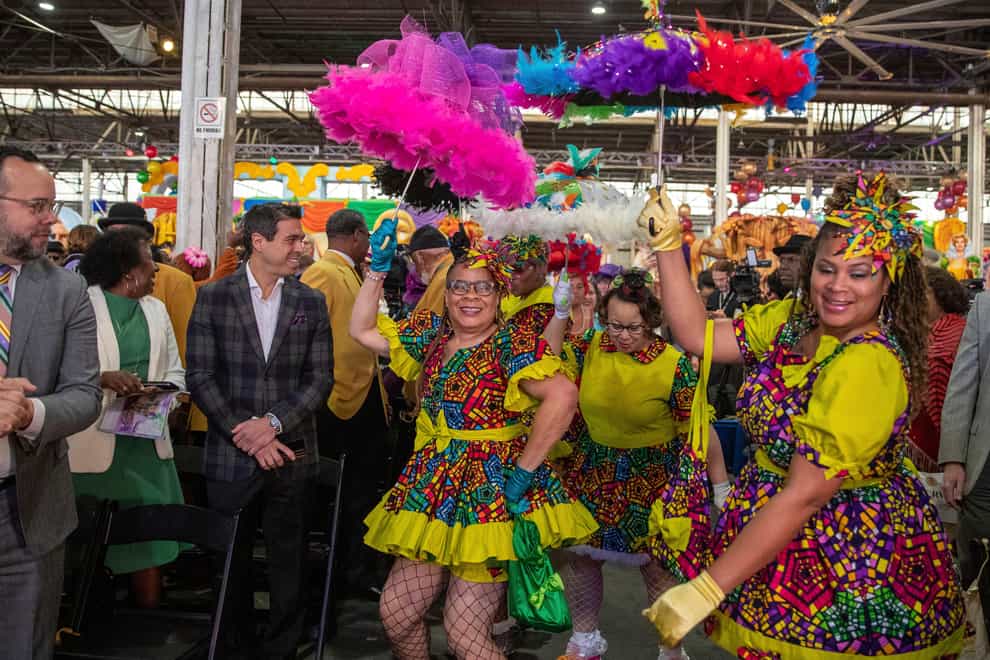 The Baby Dolls make an entrance during the King’s Day celebration while kicking-off the official start of 2023 Carnival Season in New Orleans, Friday, Jan. 6, 2023. (David Grunfeld/The Times-Picayune/The New Orleans Advocate via AP)