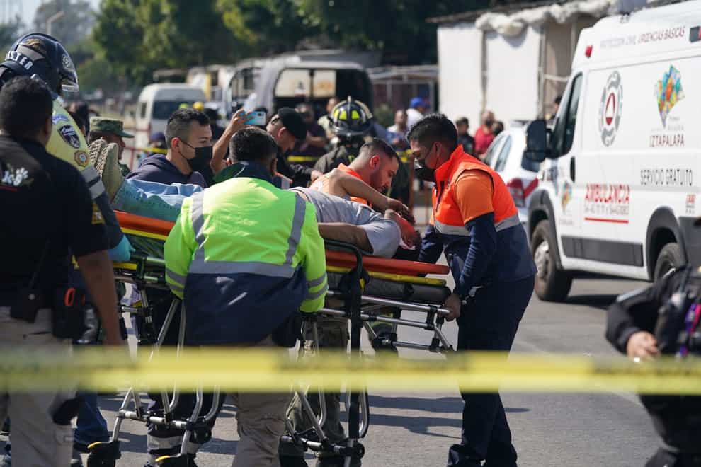 An injured passenger is taken to hospital (AP)