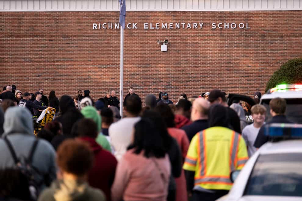 Pupils and police gather outside of Richneck Elementary School after a shooting (The Virginian-Pilot via AP)