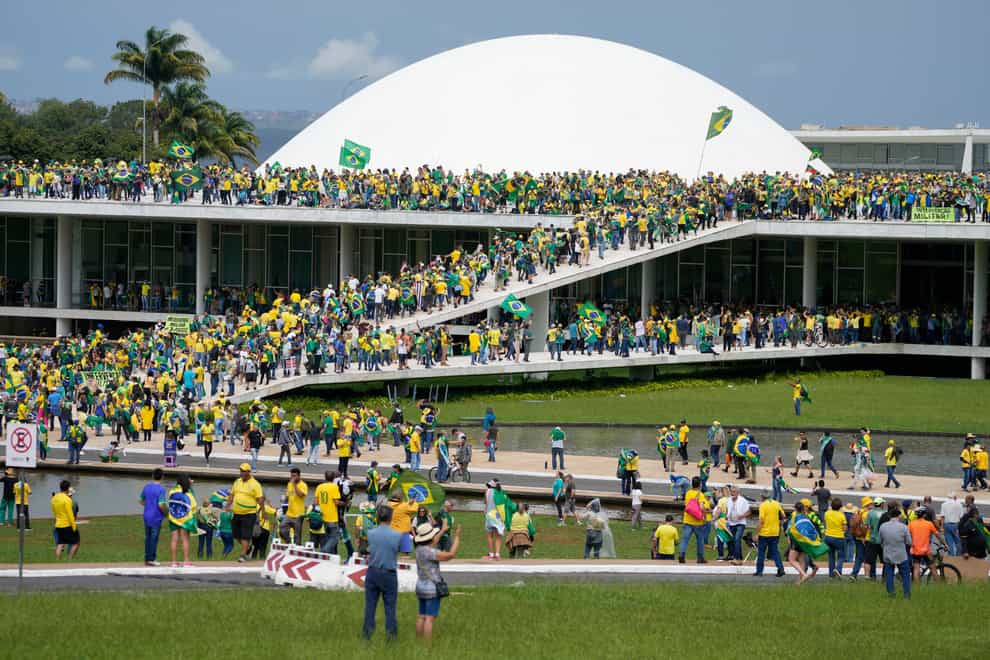 Protesters, supporters of Brazil’s former President Jair Bolsonaro, storm the the National Congress building in Brasilia, Brazil on Sunday (Eraldo Peres/AP/PA)