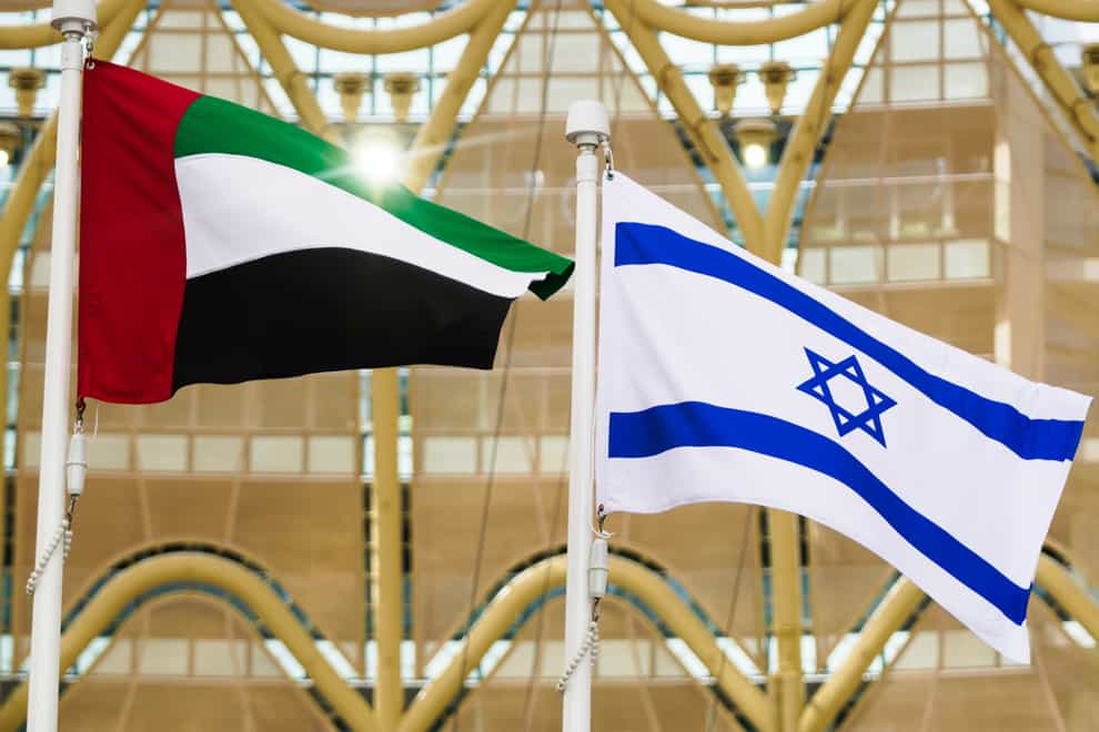The Emirati and Israeli flags fly overhead (AP)