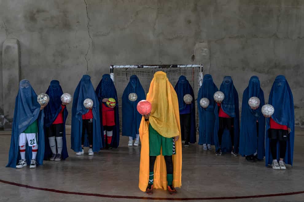 An Afghan women’s team poses for a photo in Kabul (AP)