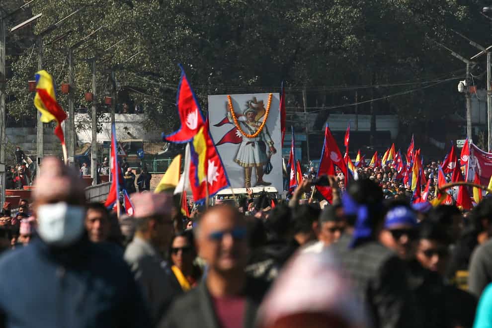 People participate in a rally to mark the birth anniversary of King Prithvi Narayan Shah in Kathmandu (AP)