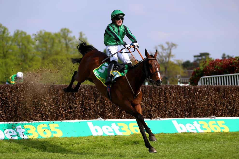Hewick ridden by jockey Jordan Gainford clears a jump on their way to winning the bet365 Gold Cup Handicap Chase during the bet365 Jump Finale Day at Sandown Park Racecourse, Esher (Nigel French/PA)