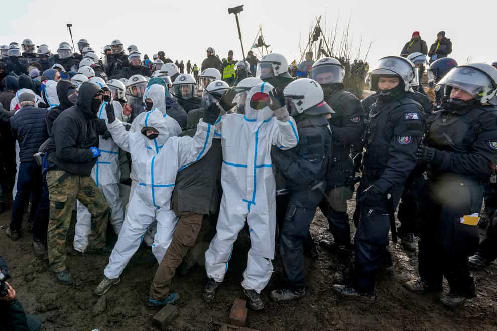 Protesters clash with police officers next to the Garzweiler lignite opencast mine at the Luetzerath village near Erkelenz, Germany (Michael Probst/AP