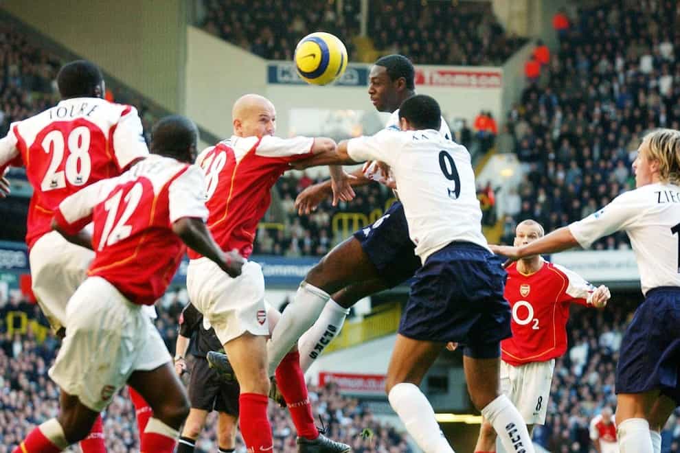 Tottenham Hotspur’s Ledley King wins the header against Arsenal’s Pascal Cygan (centre left) during the Barclays Premiership match at White Hart Lane, north London, Saturday November 13, 2004. THIS PICTURE CAN ONLY BE USED WITHIN THE CONTEXT OF AN EDITORIAL FEATURE. NO WEBSITE/INTERNET USE UNLESS SITE IS REGISTERED WITH FOOTBALL ASSOCIATION PREMIER LEAGUE.