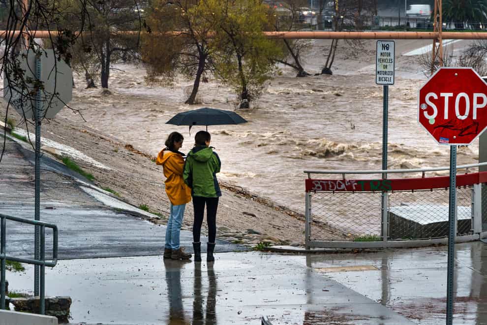 Storm-battered California got more wind, rain and snow on Saturday, raising flooding concerns, causing power outages and making travel dangerous (Damian Dovarganes/AP)