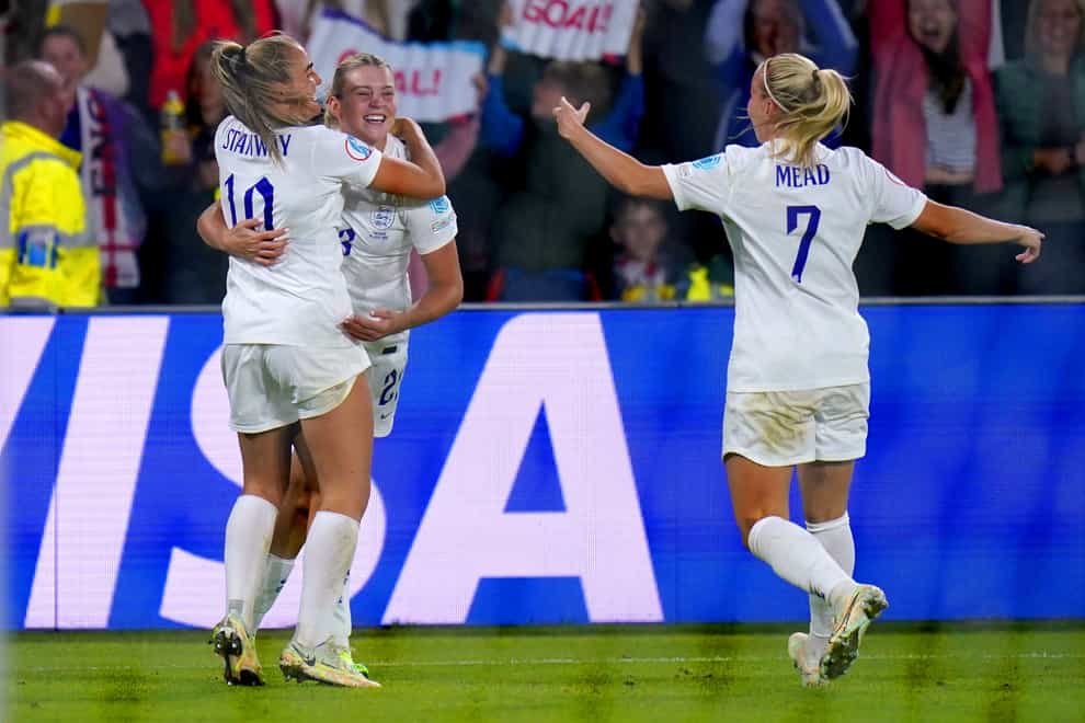 England’s Alessia Russo (second left) celebrates with her team-mates after her back-heel goal against Sweden last summer (Danny Lawson/PA).